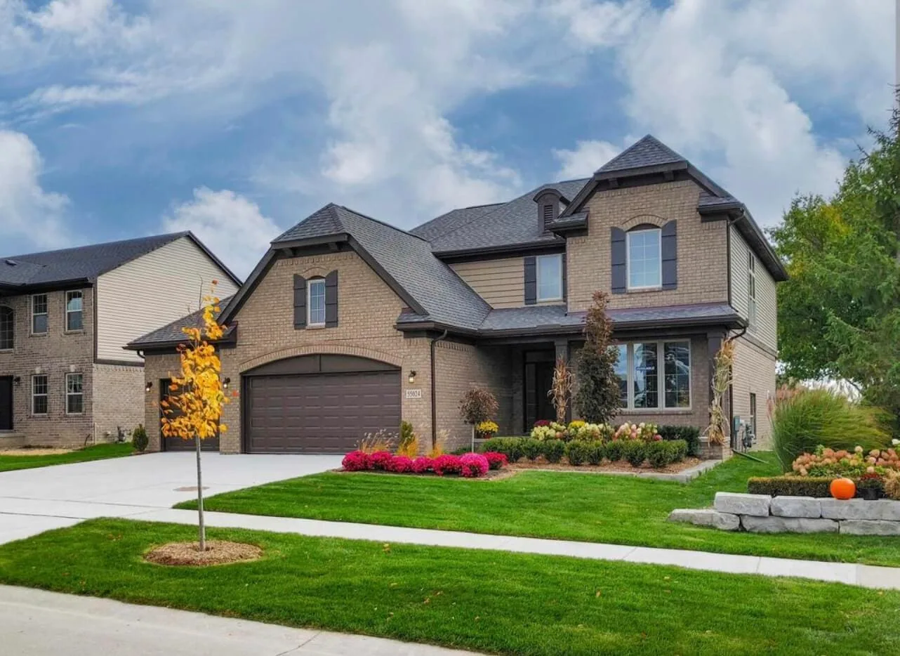 a house with a driveway and lawn