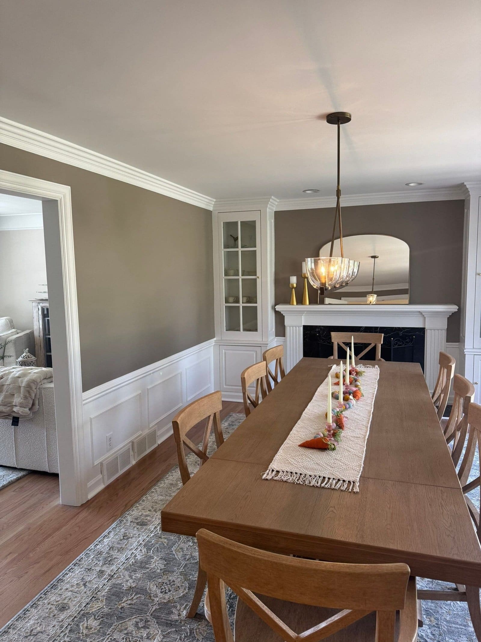 a dining table with candles on it