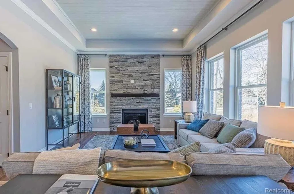 a living room with a fireplace and couches
